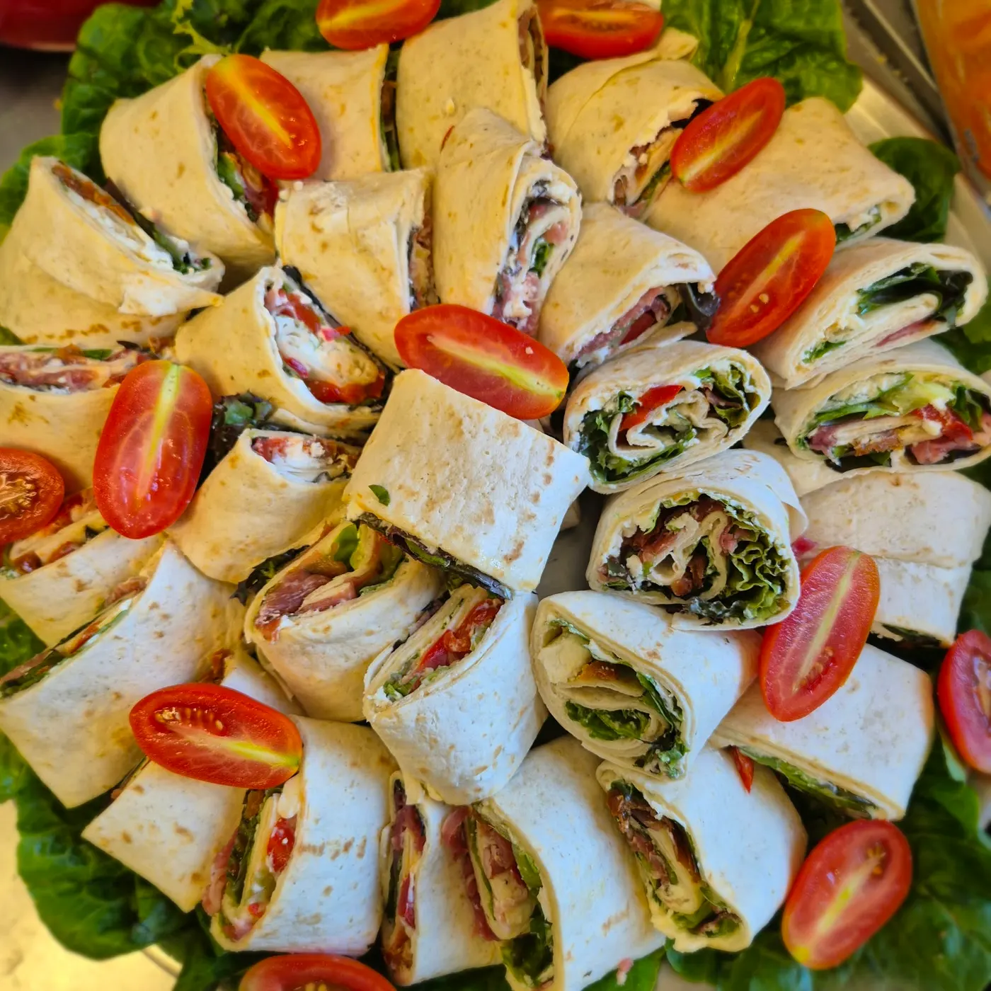 Wraps with tomatoes on a platter