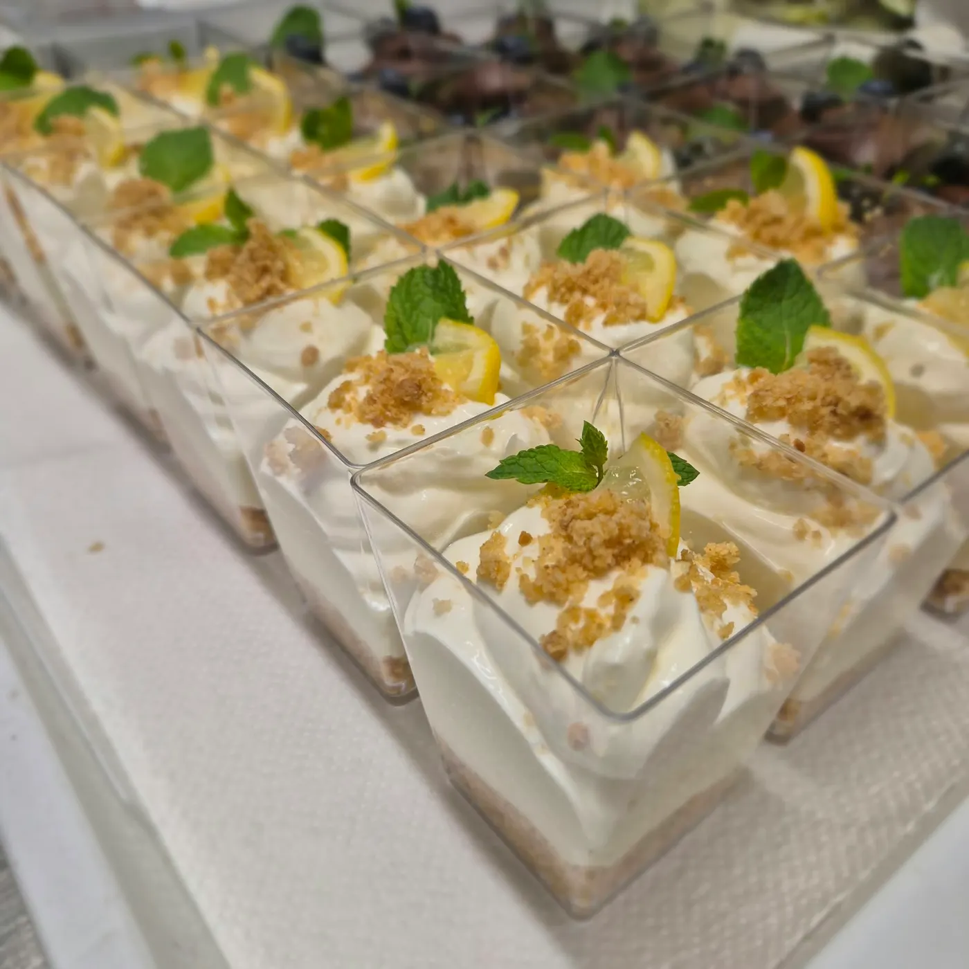 Lemon cream in a cup with crumble and mint