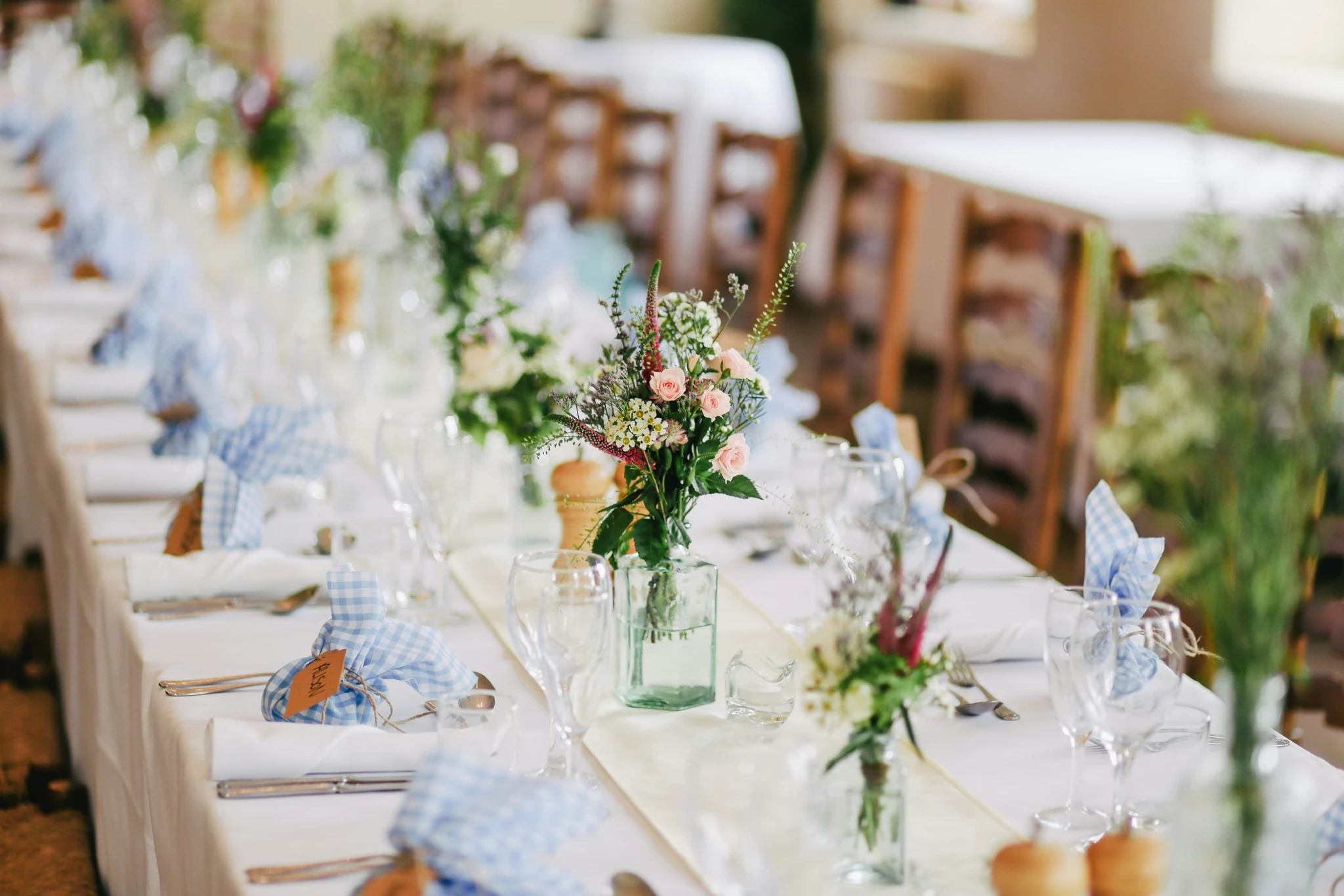 Long wedding table with wild flowers